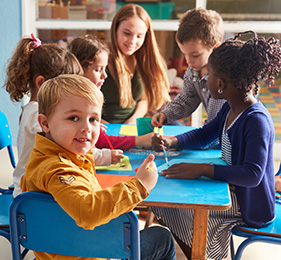 Young children working at a table